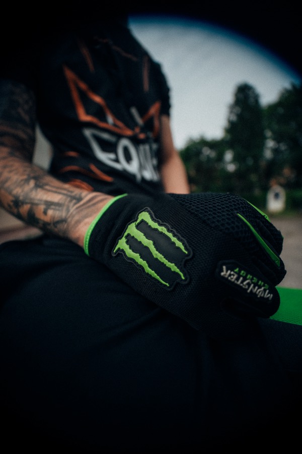 Close-up of a riding glove resting on the bike